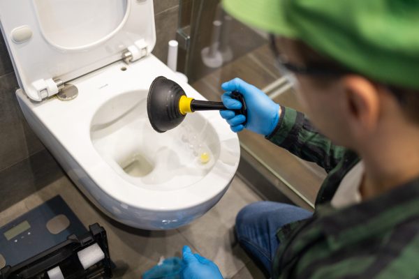 cleaning-toilet-stuck-with-suction-cup-hands-in-g-2025-03-13-00-10-32-utc